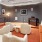 a living room with a piano and couches