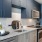a kitchen with black cabinets