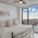 a bedroom with a large window