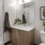 a bathroom with a sink toilet and a mirror