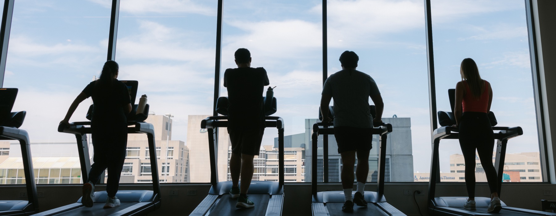 Residents on treadmills in the community gym