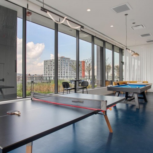 State-of-the-art amenities a pool table in a room